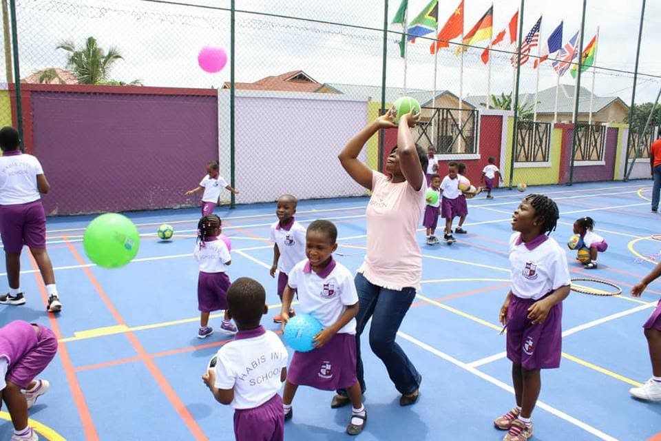 Ball games on the court beneath international flags