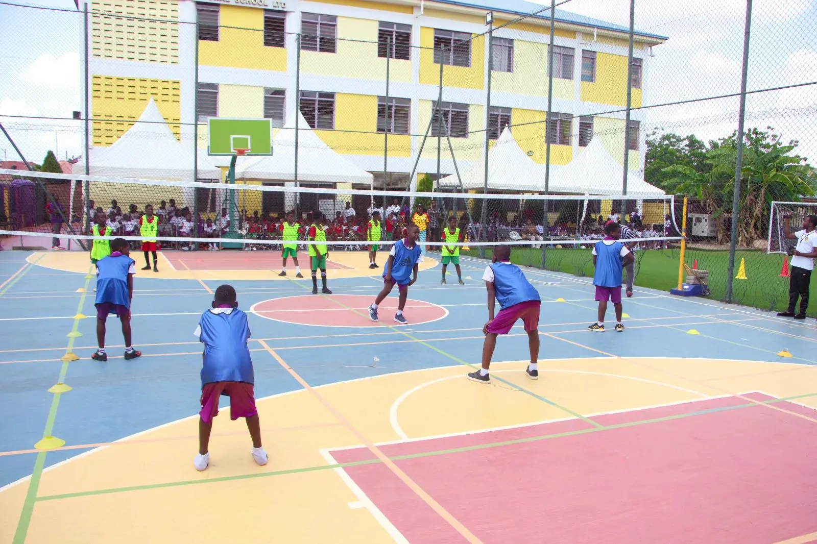 HABIS pupils practising basketball across the school court