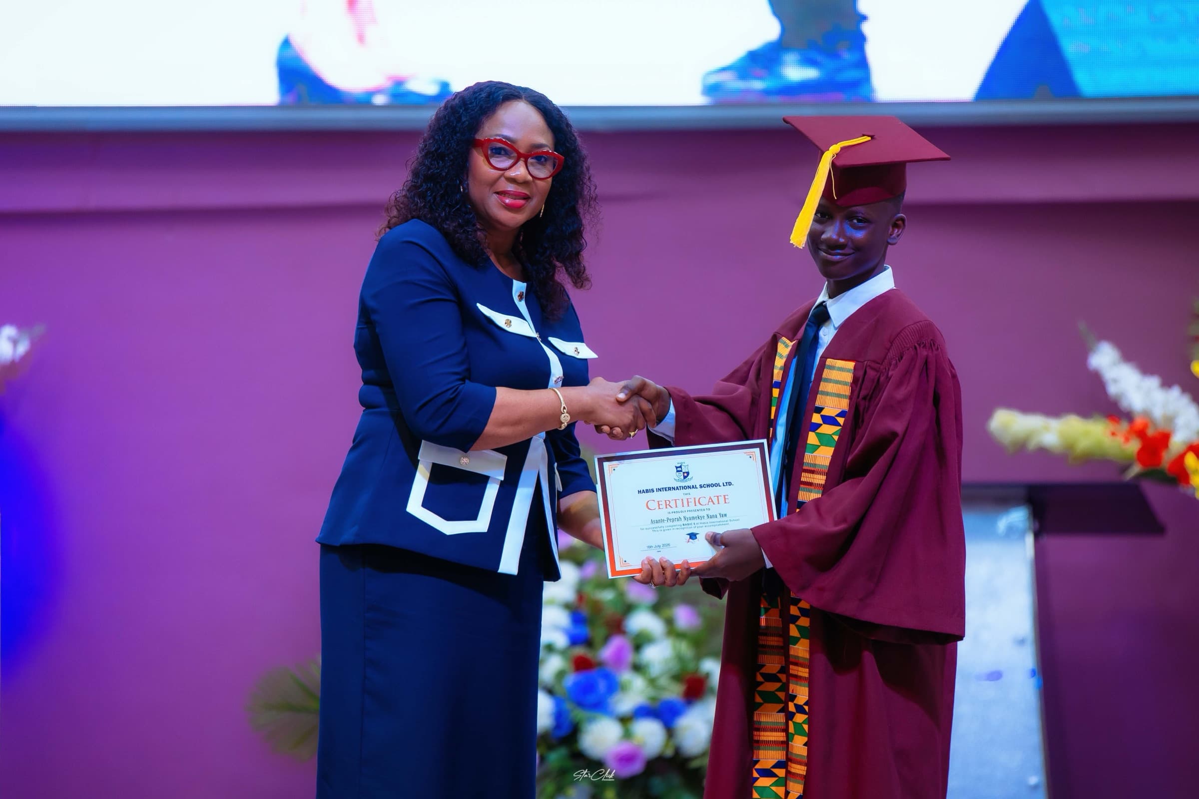 A junior high graduate receiving his certificate