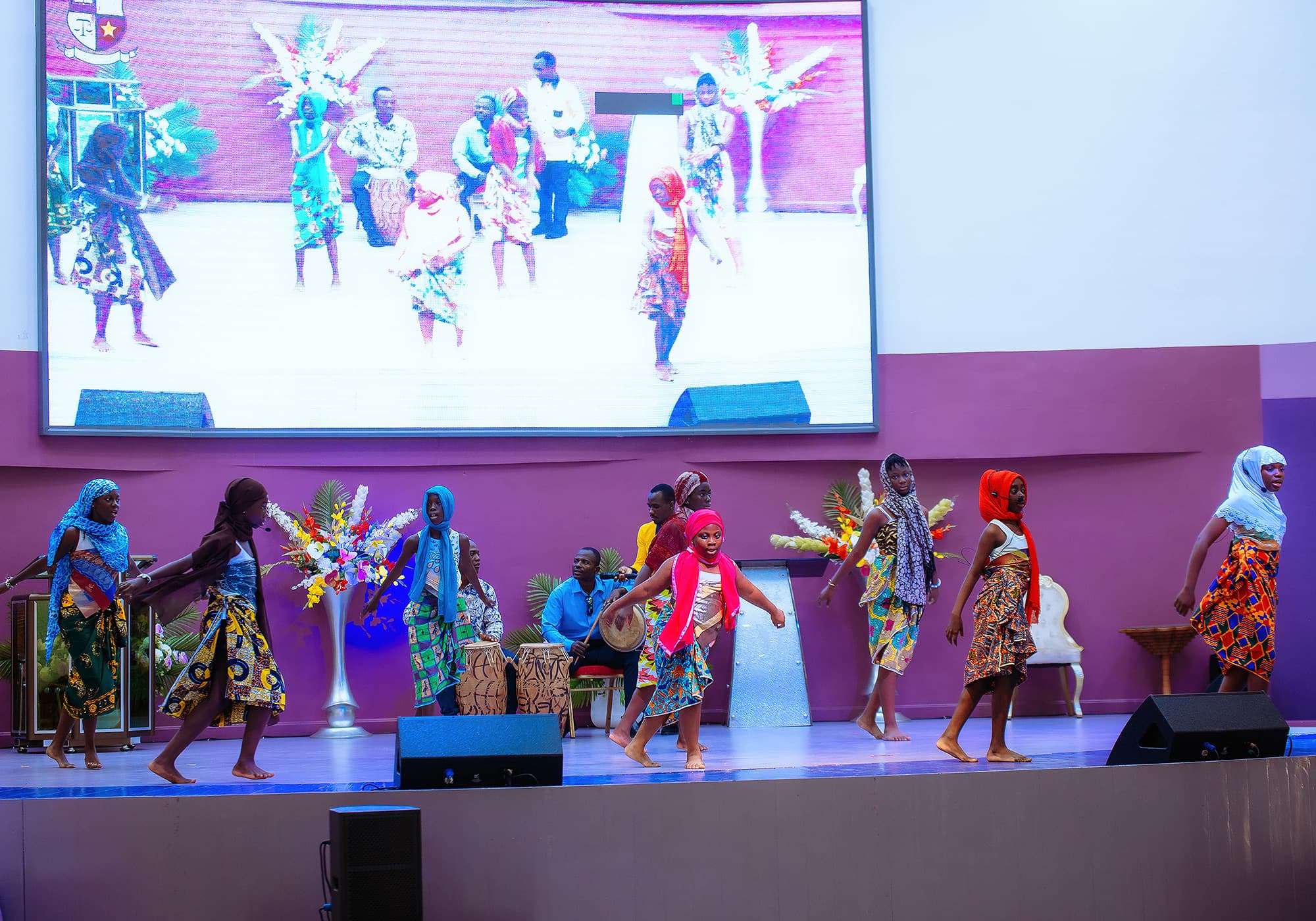 HABIS students performing a cultural dance on stage