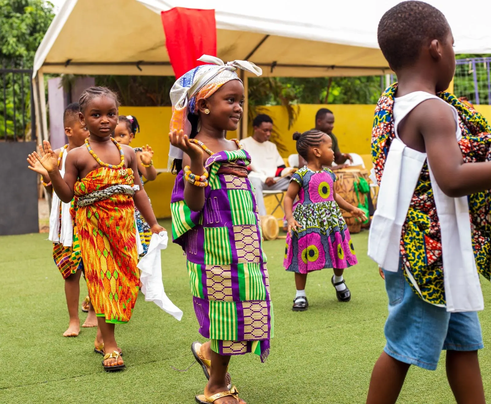 HABIS pupils stepping forward in bright traditional costumes