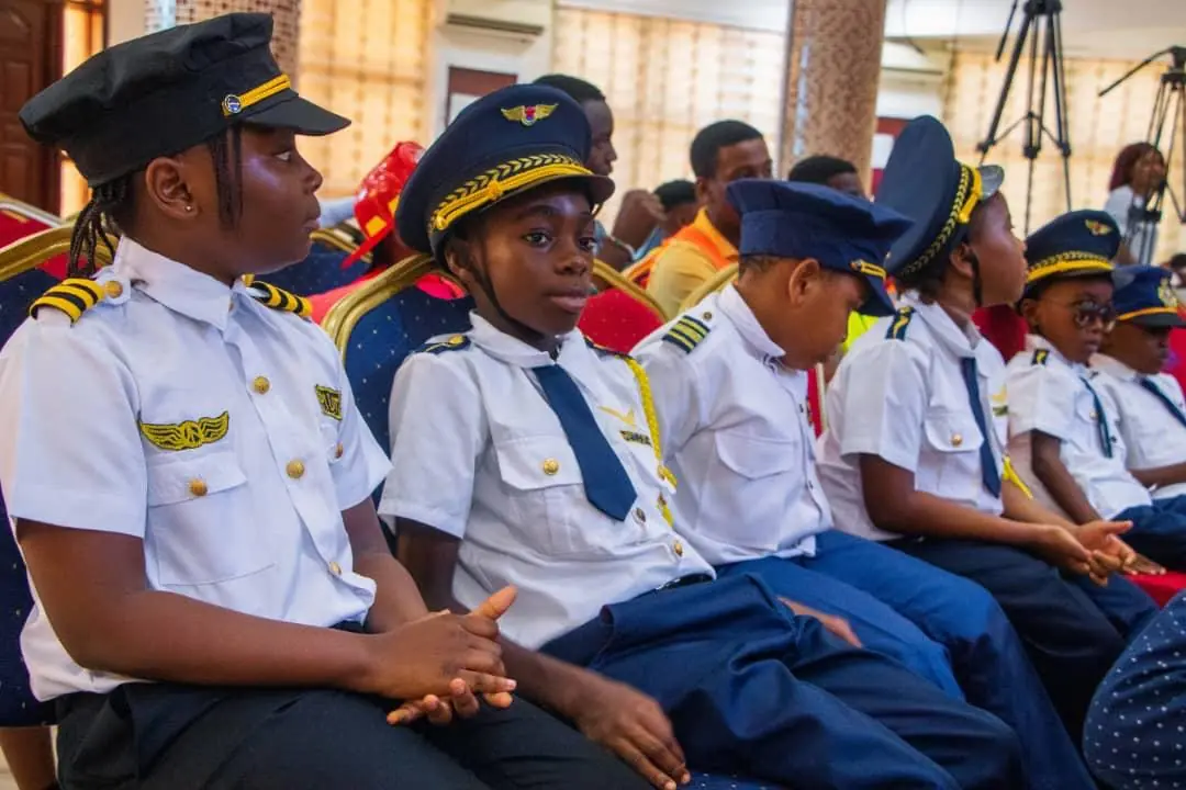 HABIS pupils seated together in white shirts and peaked costume caps